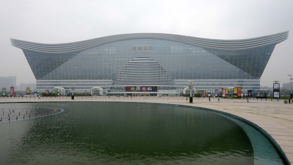 http://www.dailymail.co.uk/news/article-2360182/Take-look-inside-worlds-biggest-building-Chinese-dome-houses-shopping-centre-Mediterranean-village-water-park--ice-skating-rink-multiple-hotels.html