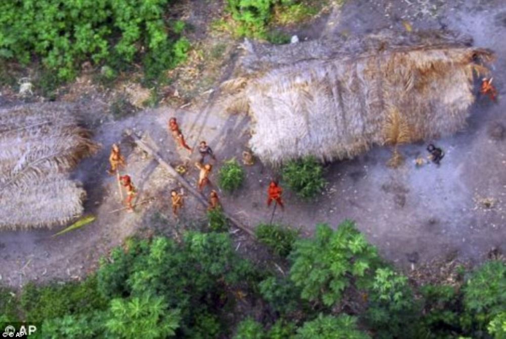 http://www.dailymail.co.uk/news/article-3946254/The-incredible-moment-Amazon-tribe-untouched-civilization-stare-wonder-photographer-s-plane-flying-them.html?ito=social-facebook