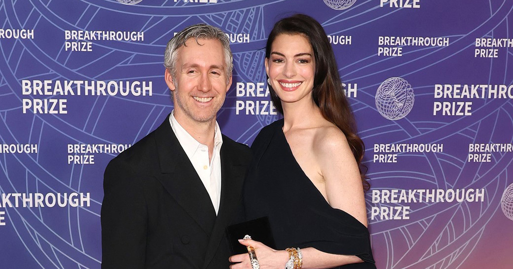 Producent Adam Shulman a herečka Anne Hathaway